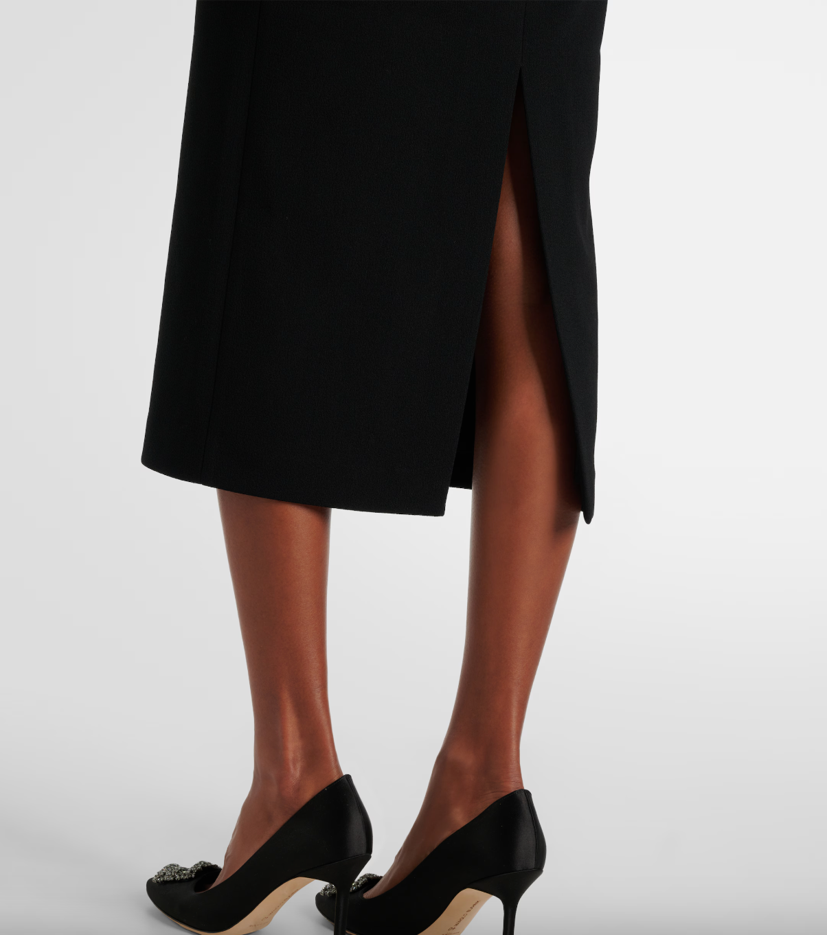 Close-up of the back split detail on the Rebecca Vallance Eliana Puff Sleeve Midi Dress