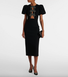 Front view of the Eliana Puff Sleeve Midi Dress by Rebecca Vallance, designed with a rounded neckline, beaded bows, front cutouts, and a cinched waist
